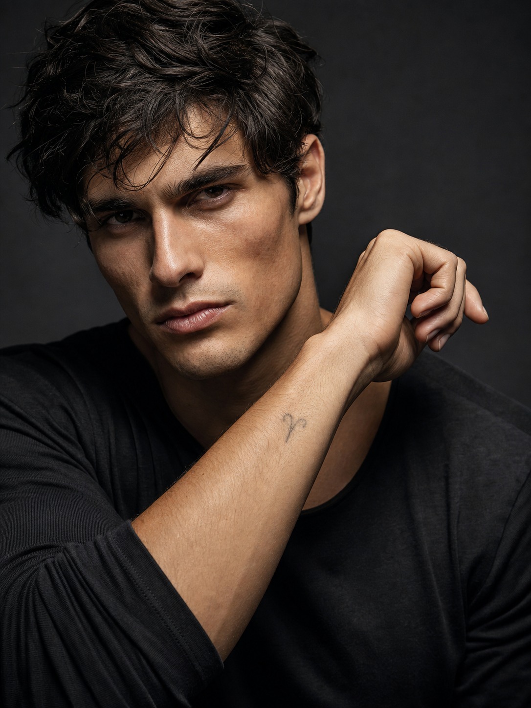 Minimalist Aries forearm zodiac tattoo A minimalist Aries ram-horn glyph tattoo on the inner forearm in editorial studio lighting. | Sky Rye Design A minimalist Aries ram-horn glyph tattoo on the inner forearm in editorial studio lighting.