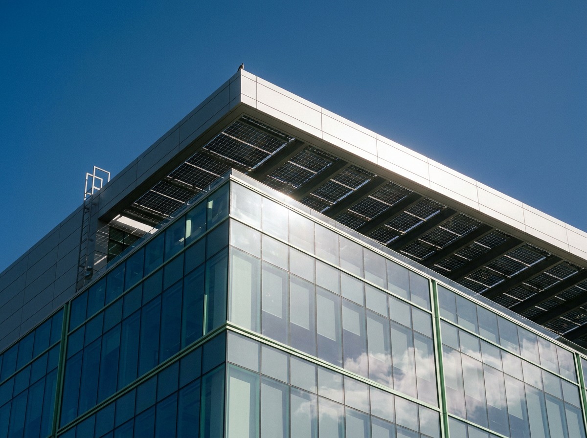 Net-zero facade: performance glazing and rooftop solar Net-zero commercial facade with performance glazing and rooftop solar panels. | Sky Rye Design Net-zero commercial facade with performance glazing and rooftop solar panels.