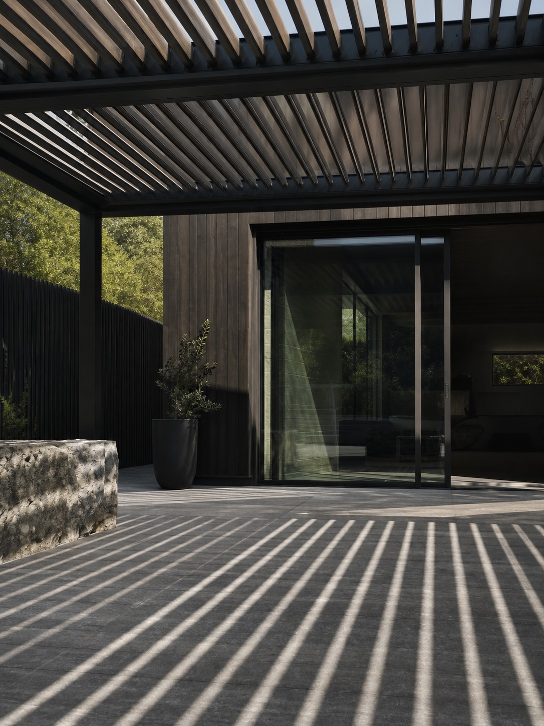 Pergola louver shade pattern Modern pergola louvers casting sharp shade lines over a patio door and stone floor. | Sky Rye Design Modern pergola louvers casting sharp shade lines over a patio door and stone floor.