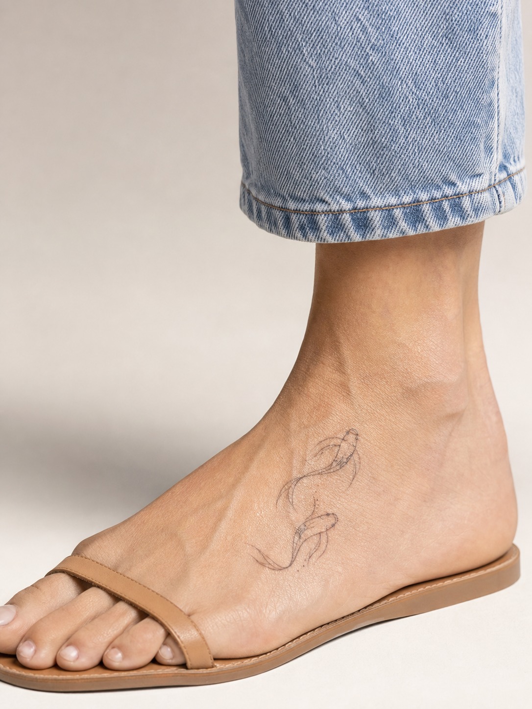 Pisces flowing foot zodiac tattoo A flowing Pisces two-fish glyph tattoo curving along the top of the foot. | Sky Rye Design A flowing Pisces two-fish glyph tattoo curving along the top of the foot.