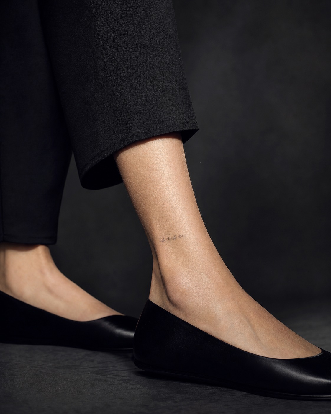 Sisu ankle word tattoo Small sisu word tattoo above the ankle bone, an example of a foreign-language tattoo word. | Sky Rye Design Small sisu word tattoo above the ankle bone, an example of a foreign-language tattoo word.
