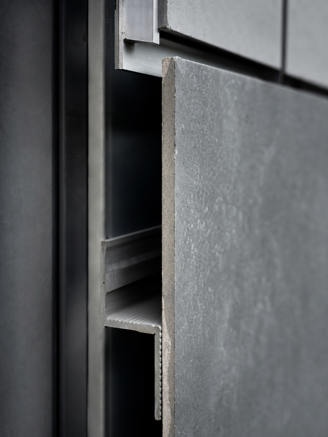 Rainscreen panel ventilated cavity detail Close-up of a rainscreen cladding panel showing the ventilated cavity and metal sub-frame. | Sky Rye Design Close-up of a rainscreen cladding panel showing the ventilated cavity and metal sub-frame.