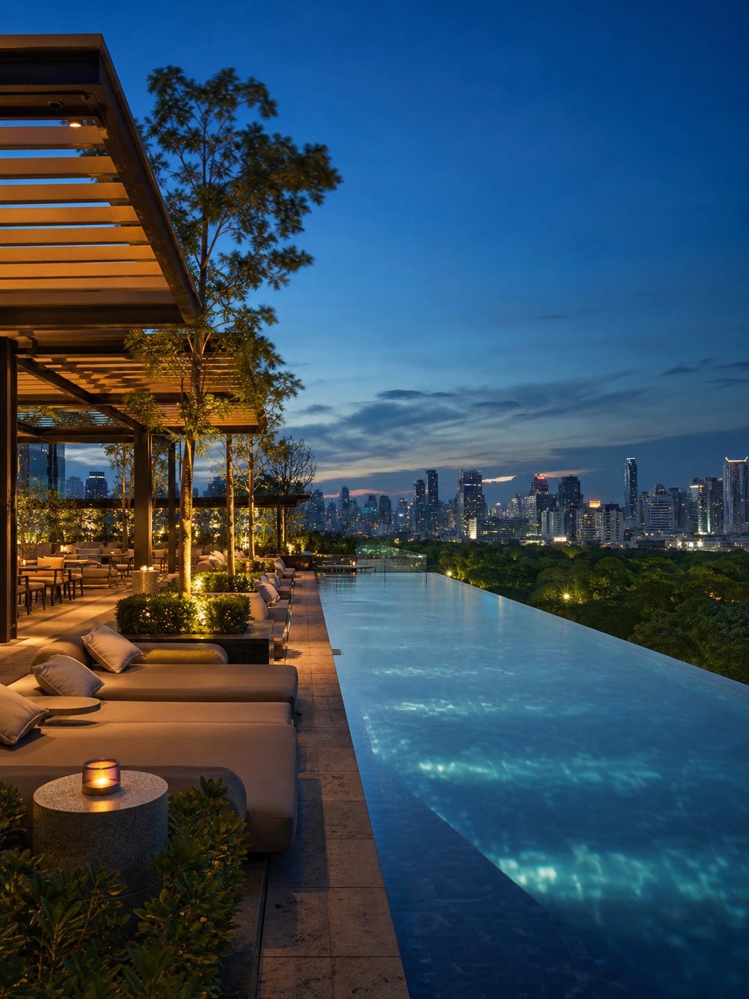 Rooftop amenity deck with an infinity pool, pergola seating, and a skyline view at dusk.