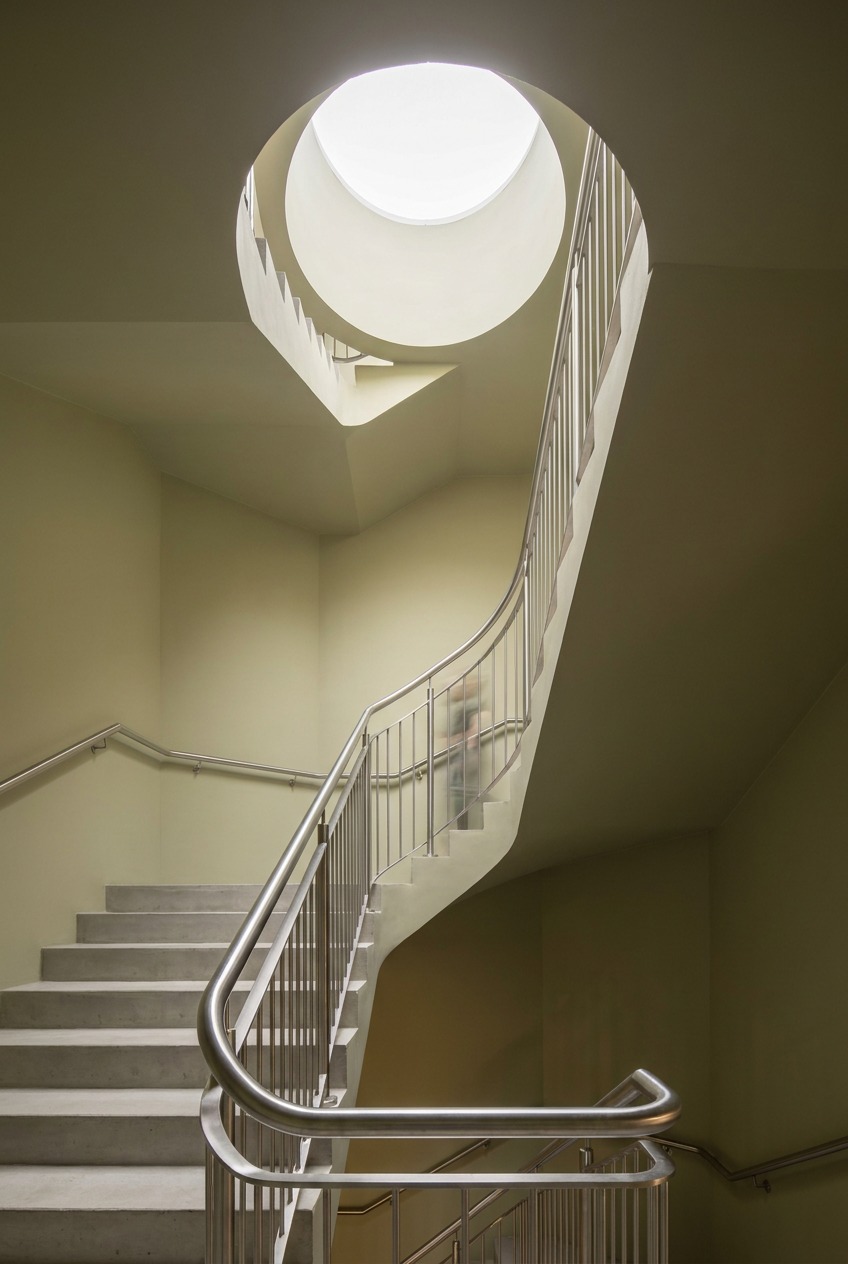 Stairwell with a Confident Well-Maintained Color Commercial stairwell painted in a confident well-maintained mid-tone color with skylight above | Sky Rye Design Commercial stairwell painted in a confident well-maintained mid-tone color with skylight above
