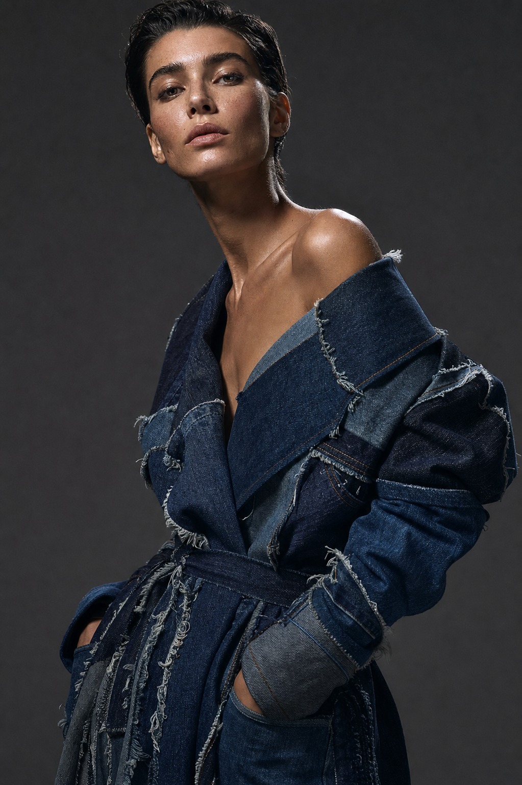 Recycled denim couture editorial for sustainable fashion brands High-fashion model wearing a recycled denim couture coat with patchworked indigo fabric and raw seams | Sky Rye Design High-fashion model wearing a recycled denim couture coat with patchworked indigo fabric and raw seams
