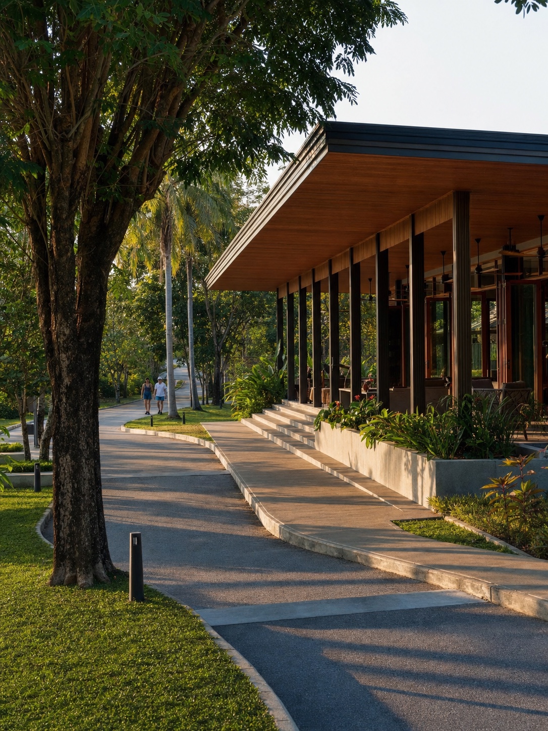 Tropical modern clubhouse along a residential loop Tropical modernist clubhouse with wide eaves beside a landscaped residential path | Sky Rye Design Tropical modernist clubhouse with wide eaves beside a landscaped residential path