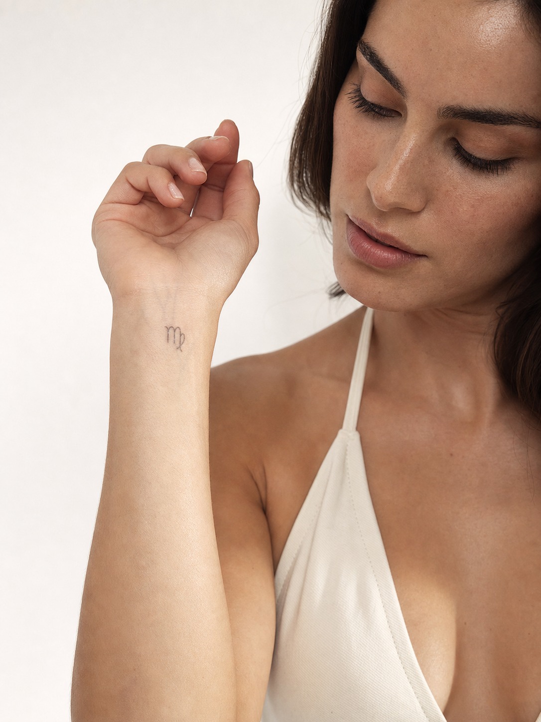 Virgo fine-line wrist zodiac tattoo A delicate Virgo glyph tattoo on the wrist with realistic healed fine-line ink. | Sky Rye Design A delicate Virgo glyph tattoo on the wrist with realistic healed fine-line ink.