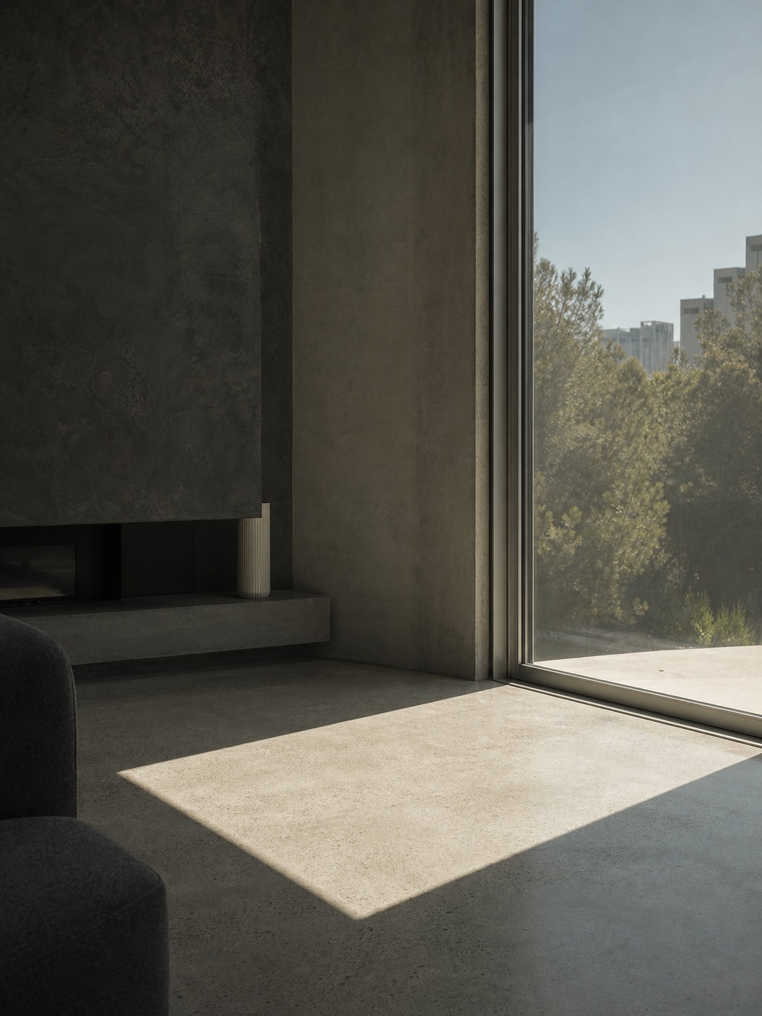 West-facing window with solar film West-facing living room window with solar film filtering afternoon sunlight across a concrete floor. | Sky Rye Design West-facing living room window with solar film filtering afternoon sunlight across a concrete floor.