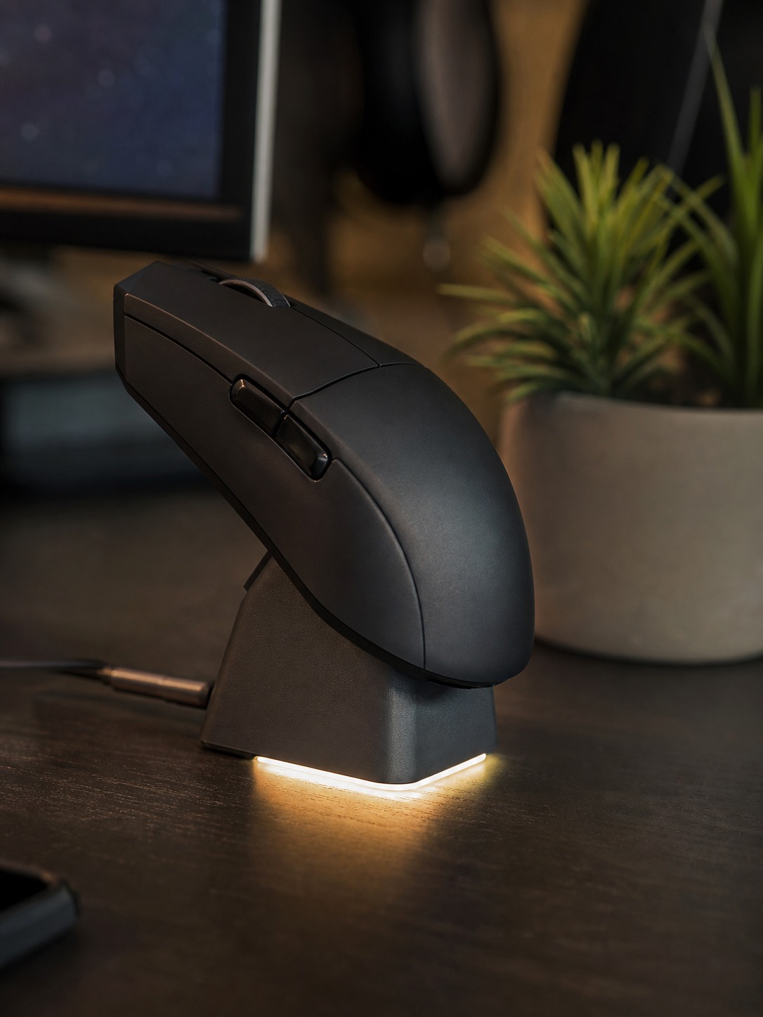 Wireless gaming mouse resting on a charging dock with a soft indicator light