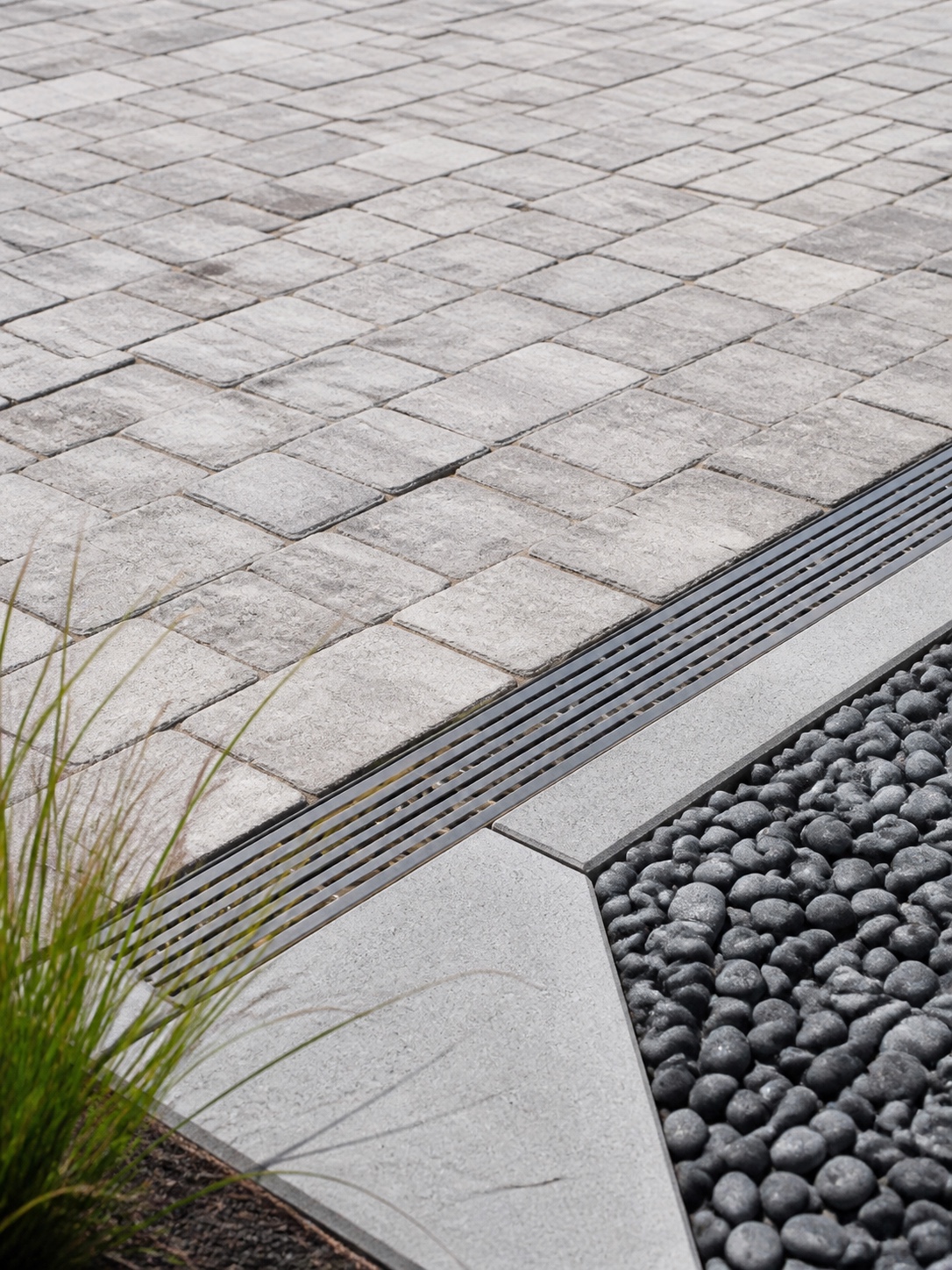 Driveway design idea - Drainage channel detail Linear drainage channel set flush into the edge of a paver driveway | Sky Rye Design Linear drainage channel set flush into the edge of a paver driveway