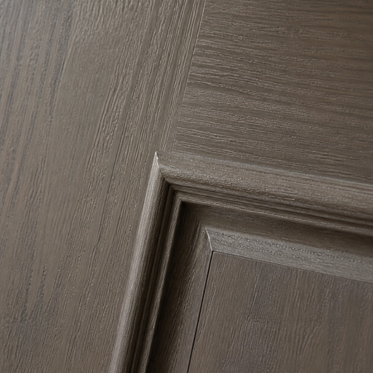 Fiberglass wood-grain front door texture Close crop of a fiberglass front door surface with convincing wood-grain texture revealed by raking light. | Sky Rye Design Close crop of a fiberglass front door surface with convincing wood-grain texture revealed by raking light.