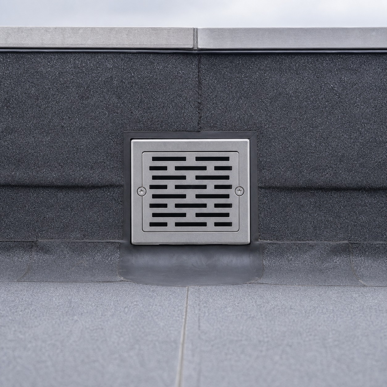Flat Roof Drainage Outlet Integrated Into Parapet Close view of a flat roof drainage outlet integrated into a parapet detail. | Sky Rye Design Close view of a flat roof drainage outlet integrated into a parapet detail.