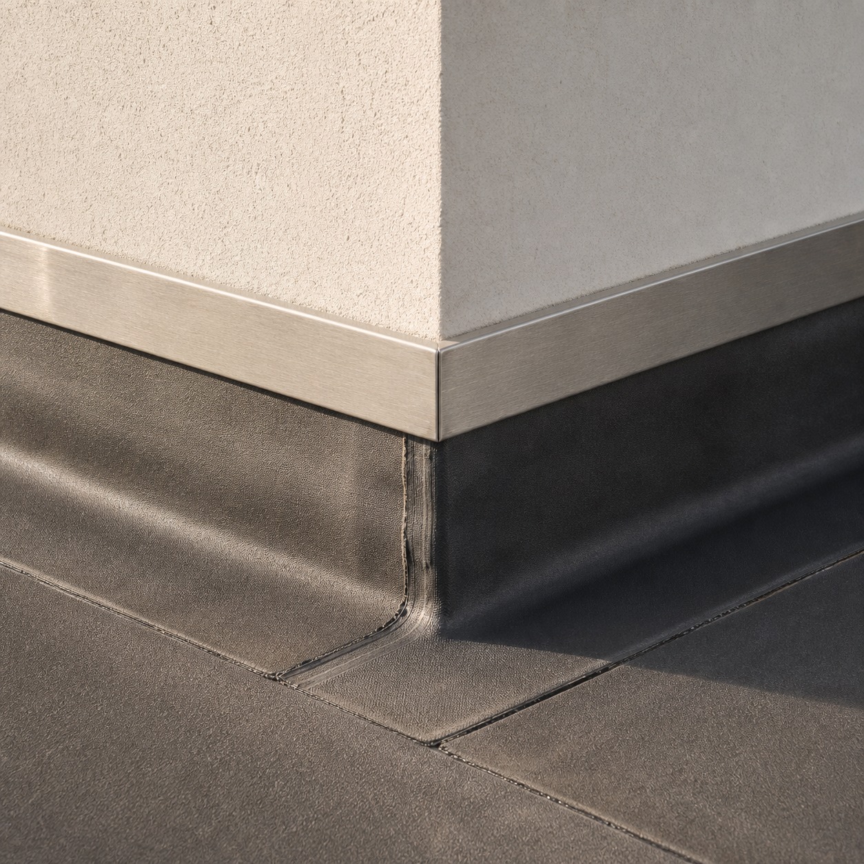 Flat Roof Upstand and Flashing Wall Junction Detailed flat roof upstand and metal flashing where the roof meets a wall. | Sky Rye Design Detailed flat roof upstand and metal flashing where the roof meets a wall.