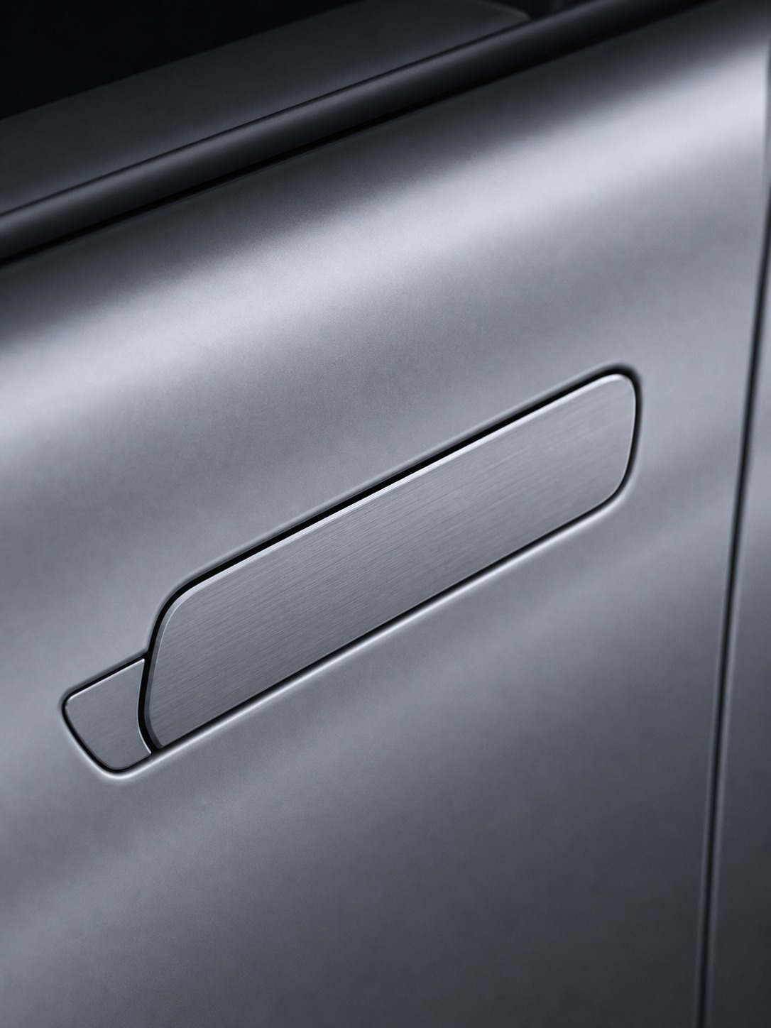 Flush door handle on an EV body A close detail of a flush door handle retracted into a painted EV body surface. | Sky Rye Design A close detail of a flush door handle retracted into a painted EV body surface.