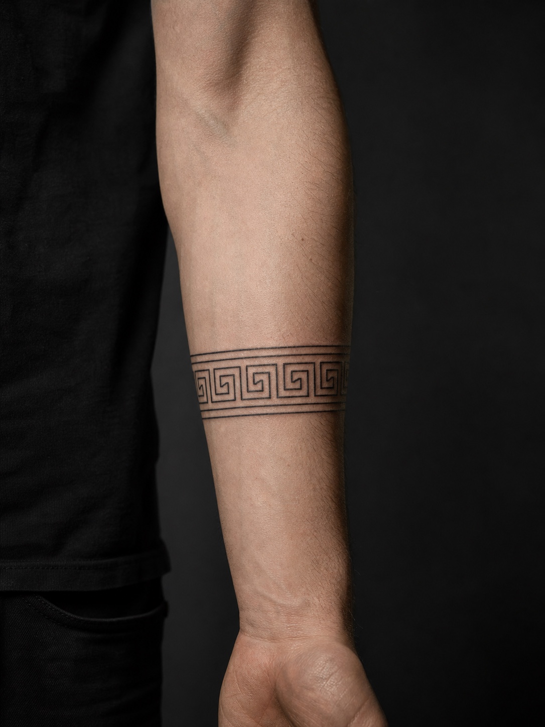 Greek key meander forearm band tattoo Precise Greek key meander band tattoo wrapped around a forearm. | Sky Rye Design Precise Greek key meander band tattoo wrapped around a forearm.