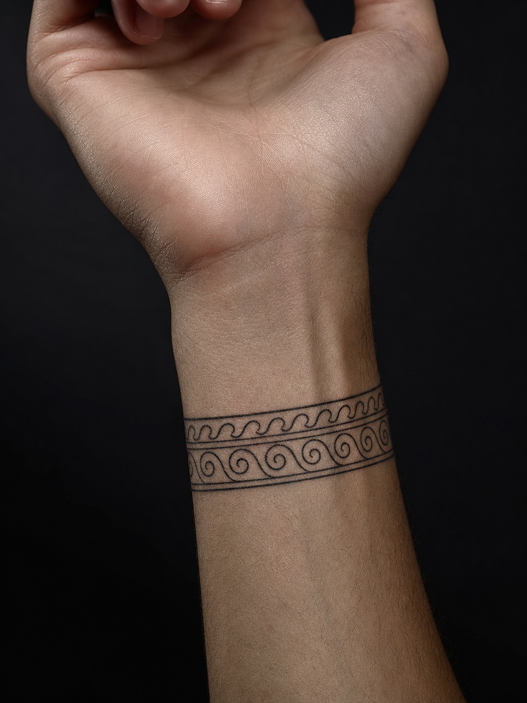 Greek wave and spiral wrist tattoo Wrist tattoo with Greek pottery-inspired wave and spiral border linework. | Sky Rye Design Wrist tattoo with Greek pottery-inspired wave and spiral border linework.