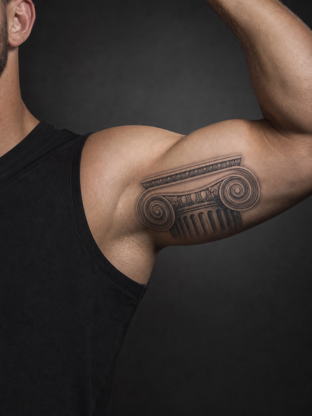 Ionic column capital bicep tattoo Ionic column capital tattoo with volute scrolls across the bicep. | Sky Rye Design Ionic column capital tattoo with volute scrolls across the bicep.