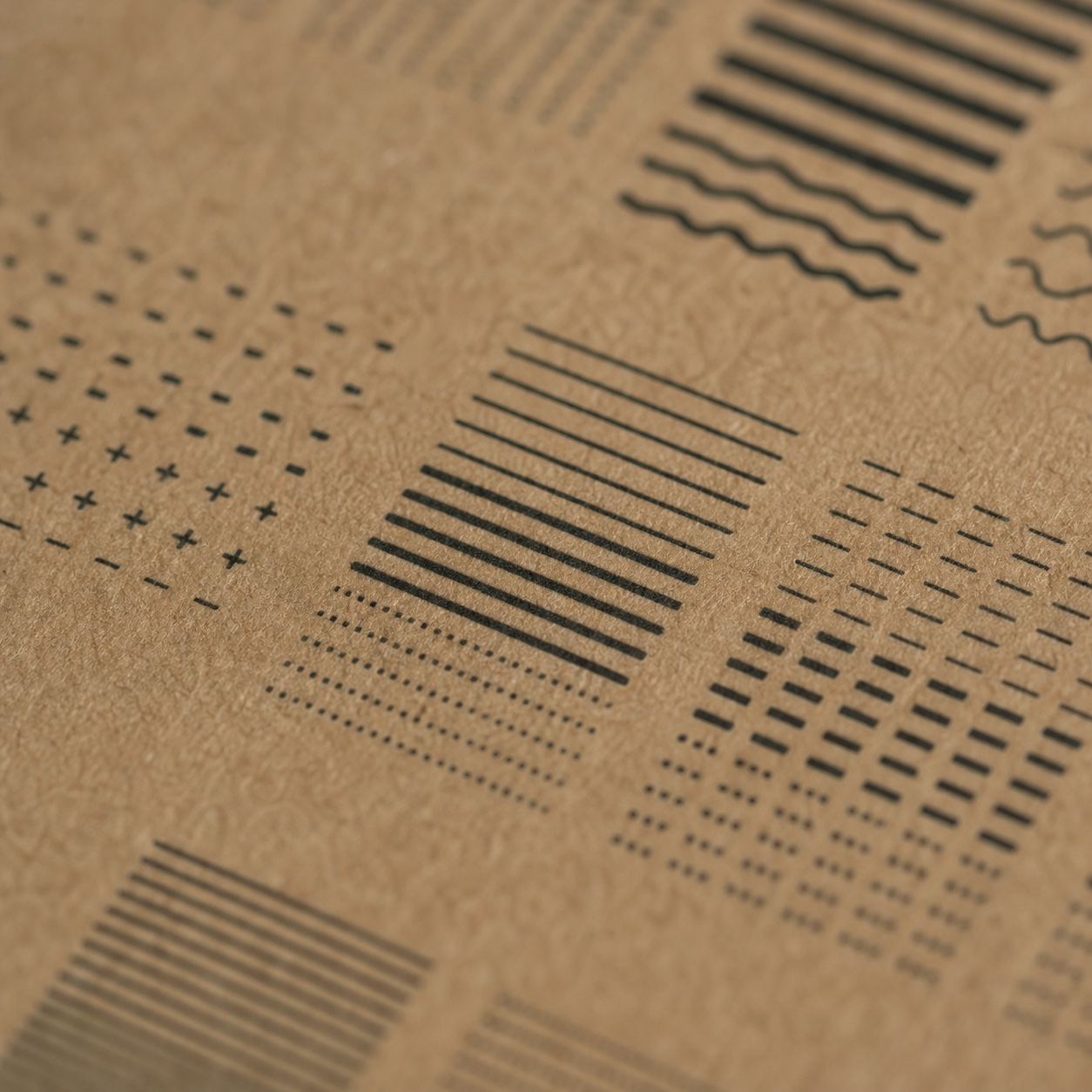 Kraft packaging typography legibility test Small type and fine line tests printed on a textured kraft substrate. | Sky Rye Design Small type and fine line tests printed on a textured kraft substrate.