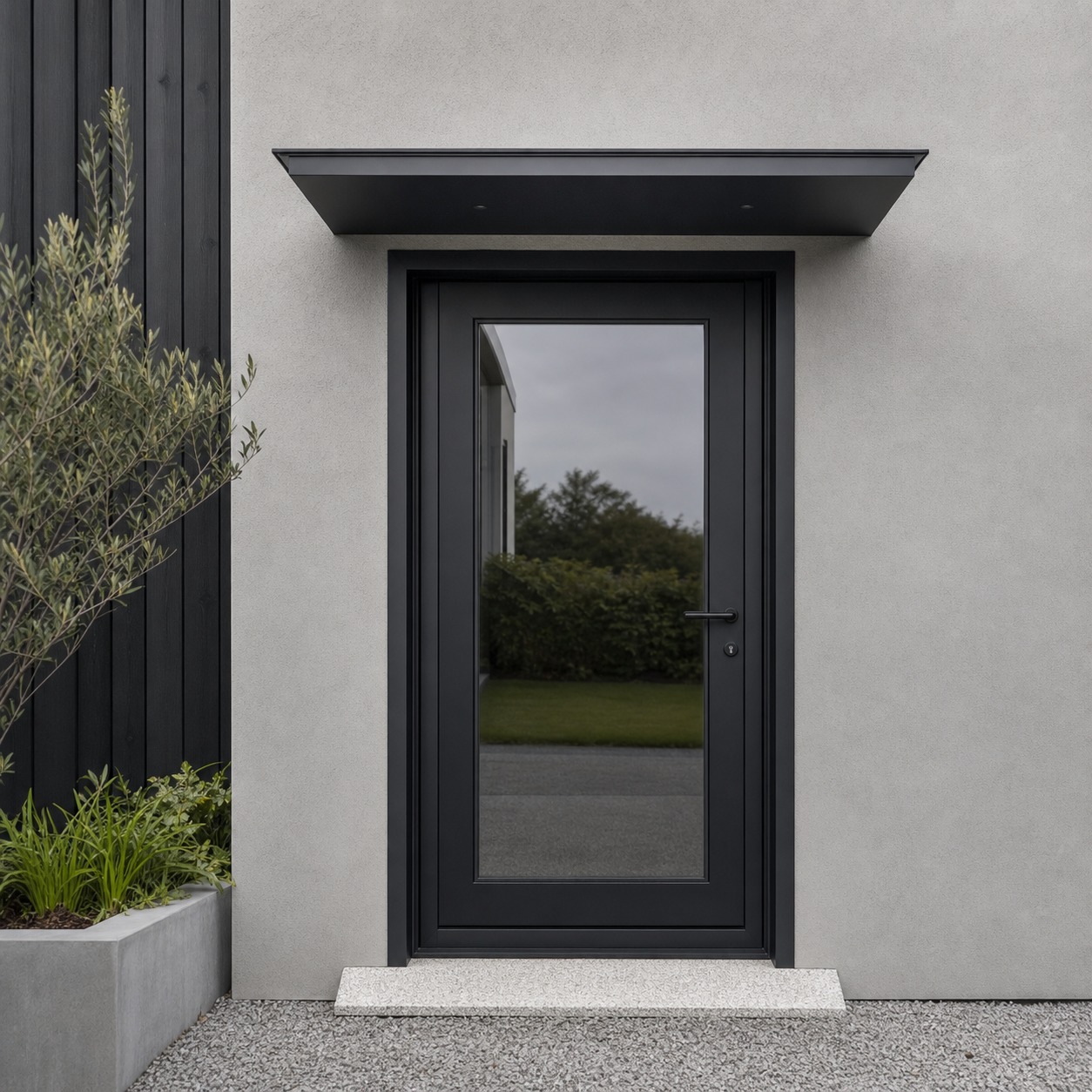 Level Threshold Annexe Entrance A minimalist annexe entrance with a level stone threshold and black steel door. | Sky Rye Design A minimalist annexe entrance with a level stone threshold and black steel door.