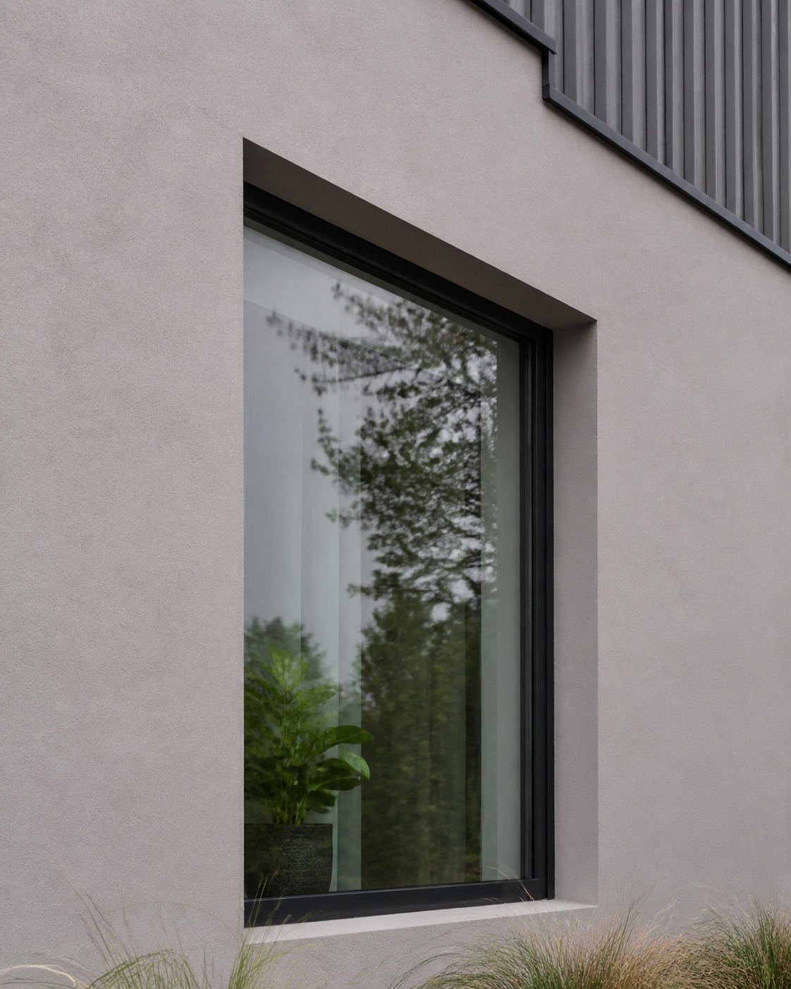 Modern flush-reveal window detail Modern window set nearly flush into a smooth exterior wall with minimal trim. | Sky Rye Design Modern window set nearly flush into a smooth exterior wall with minimal trim.