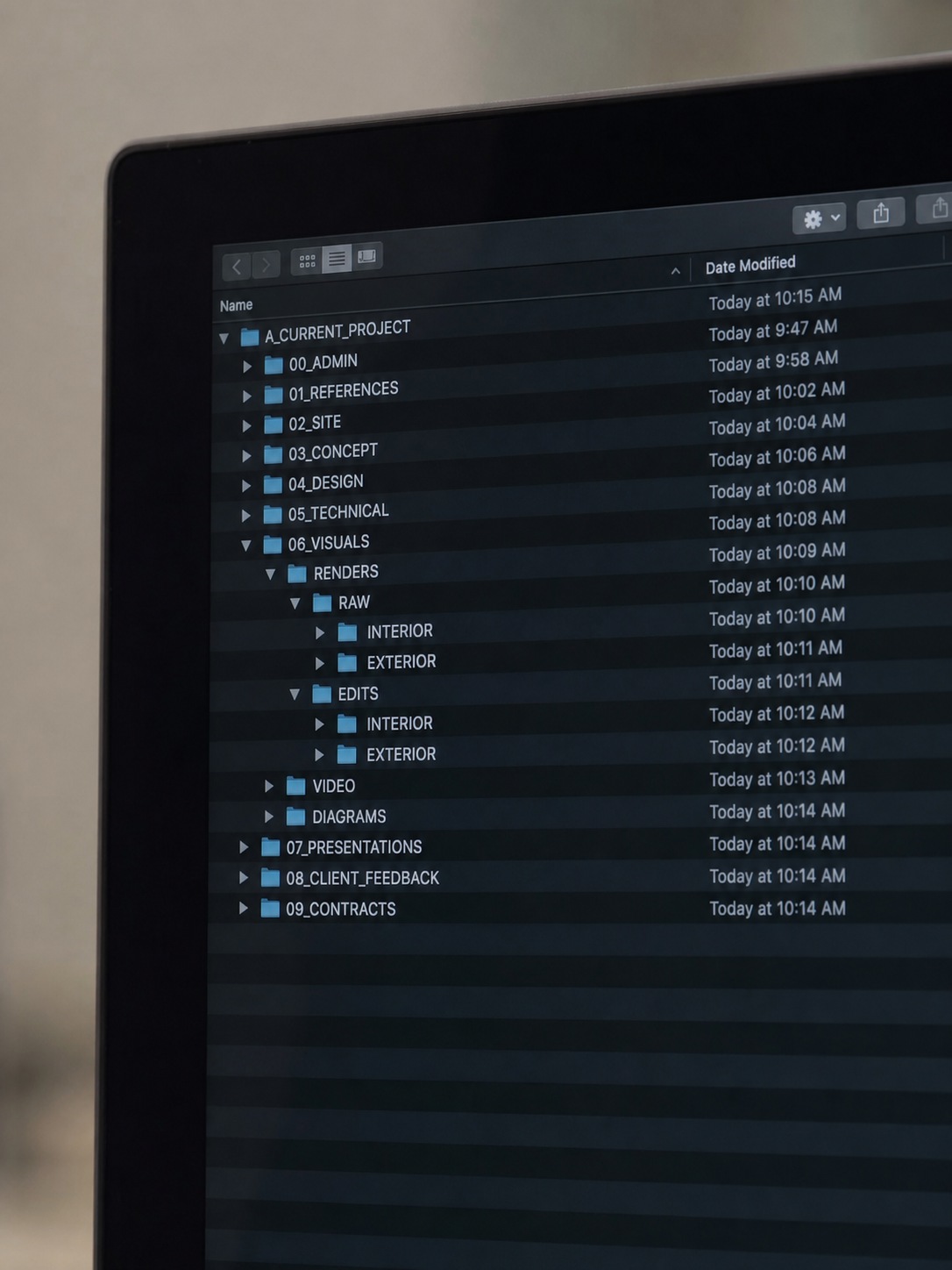 Organized shared folder structure on screen Organized shared folder structure for a design project displayed on a studio monitor. | Sky Rye Design Organized shared folder structure for a design project displayed on a studio monitor.