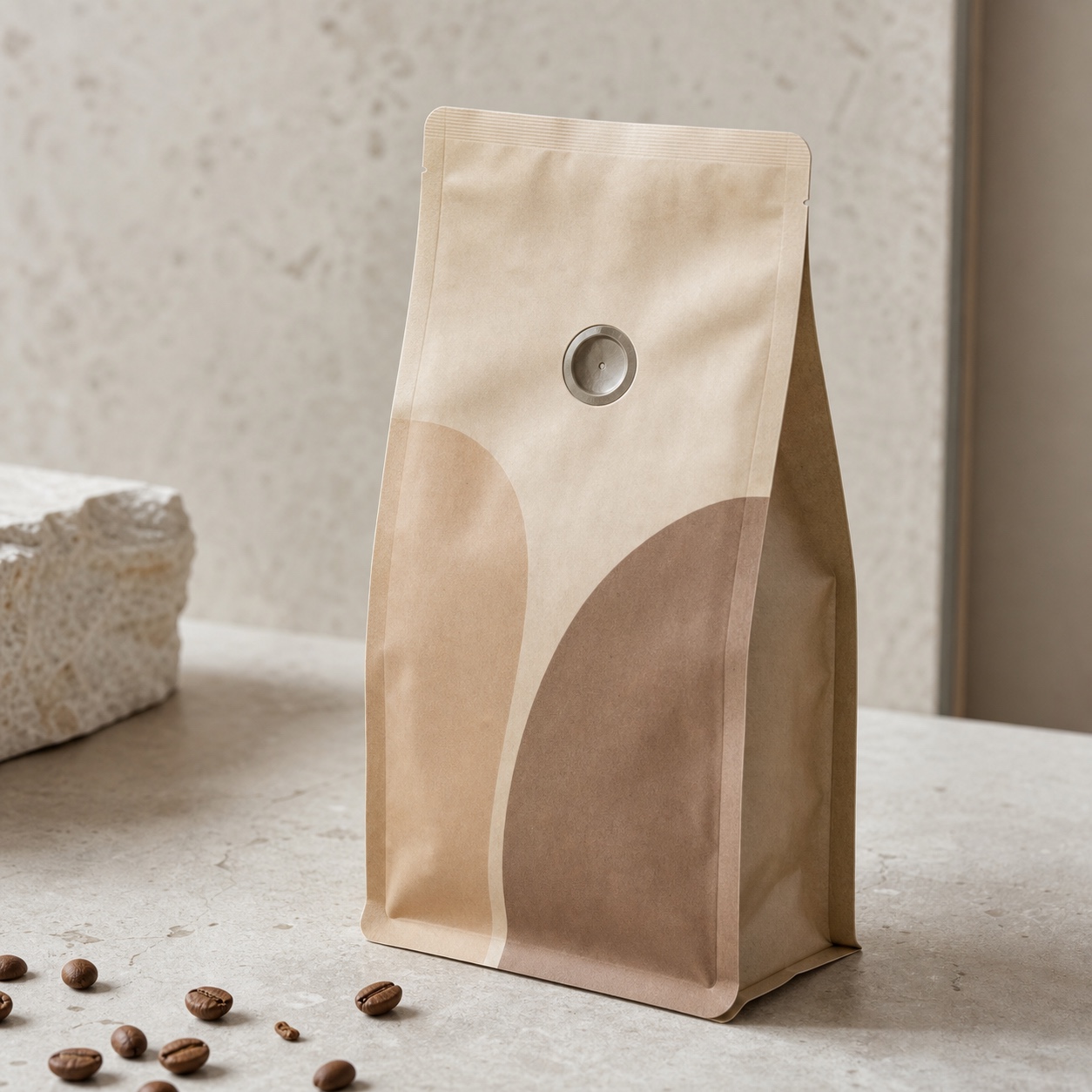 Recyclable coffee pouch valve detail Recyclable coffee pouch with a visible valve and minimal kraft-toned branding. | Sky Rye Design Recyclable coffee pouch with a visible valve and minimal kraft-toned branding.
