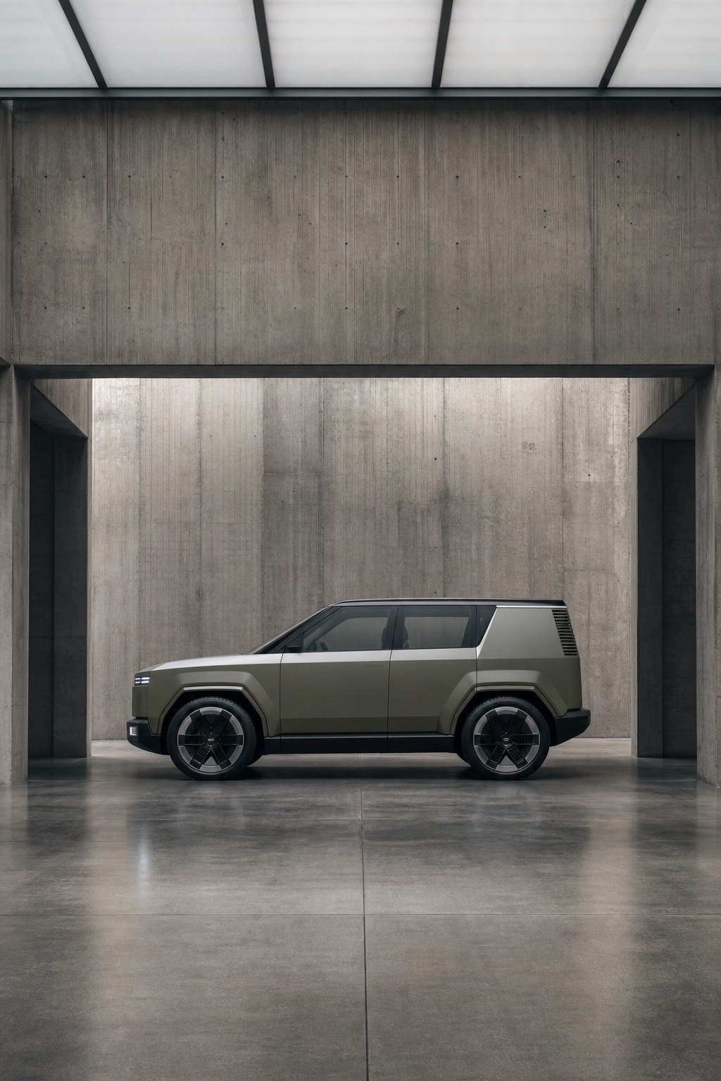 Retro-futurist boxy EV in concrete studio A boxy retro-futurist EV silhouette parked in an architectural concrete studio space. | Sky Rye Design A boxy retro-futurist EV silhouette parked in an architectural concrete studio space.