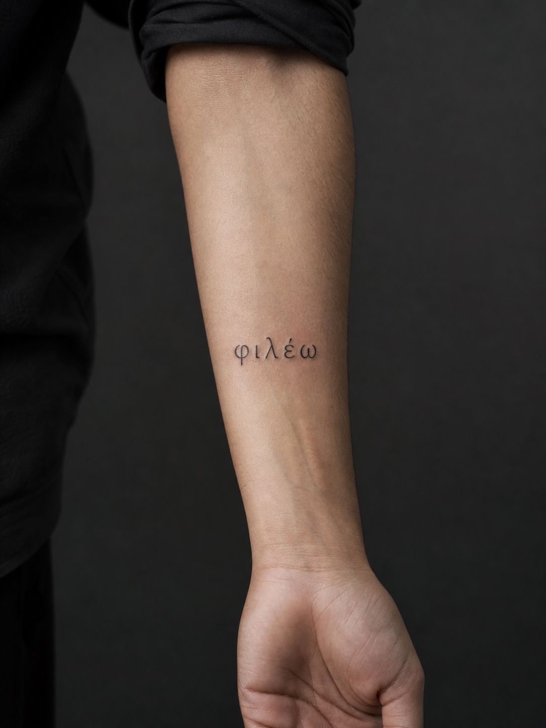 Short Greek lettering forearm tattoo Short Greek-letter tattoo on the inner forearm with careful spacing. | Sky Rye Design Short Greek-letter tattoo on the inner forearm with careful spacing.