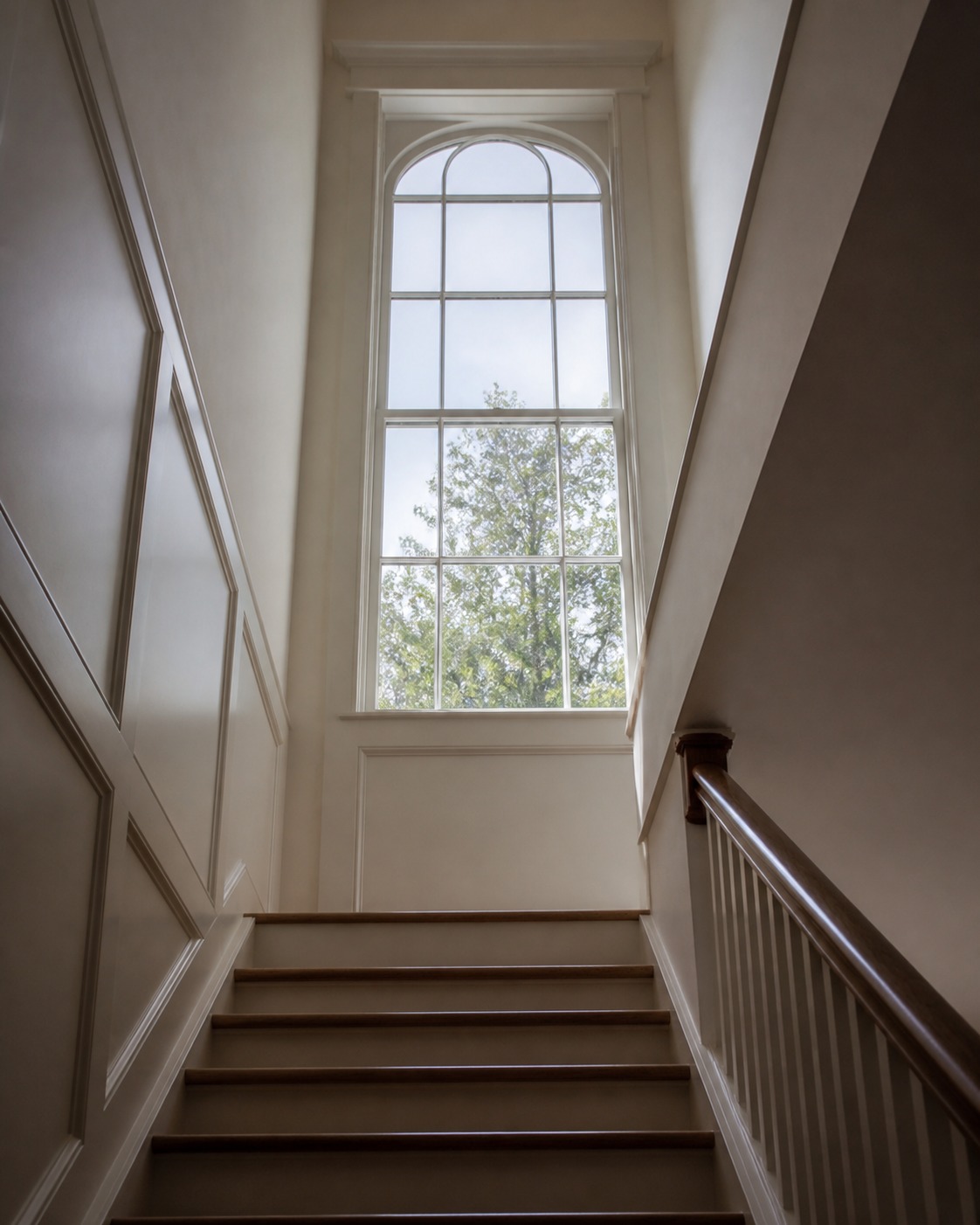 Stairwell feature window with proportioned trim Tall stairwell feature window with proportioned trim and soft light falling down the stairs. | Sky Rye Design Tall stairwell feature window with proportioned trim and soft light falling down the stairs.