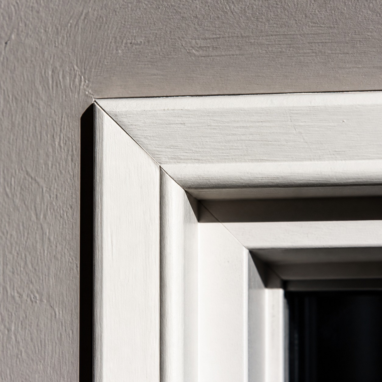 Window casing reveal and shadow detail Close-up of a painted window casing corner with a clear reveal shadow line. | Sky Rye Design Close-up of a painted window casing corner with a clear reveal shadow line.
