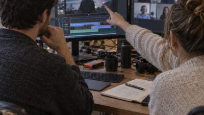 Distributed marketing team reviewing a video together with focused comments