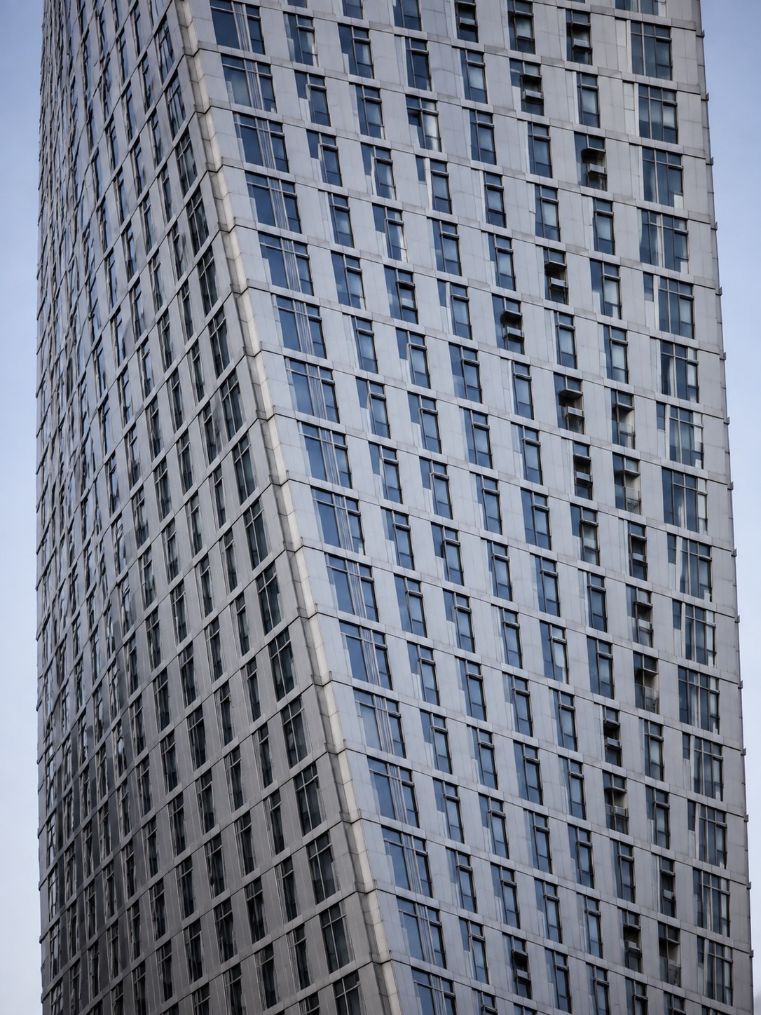 Close architectural view of Cayan Tower showing its twisting facade geometry.