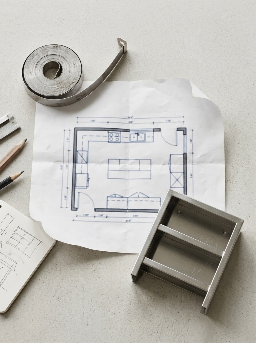 Commercial Kitchen Design Tools Tape measure, freezer floor plan and stainless shelving sample on a design desk | Sky Rye Design Tape measure, freezer floor plan and stainless shelving sample on a design desk