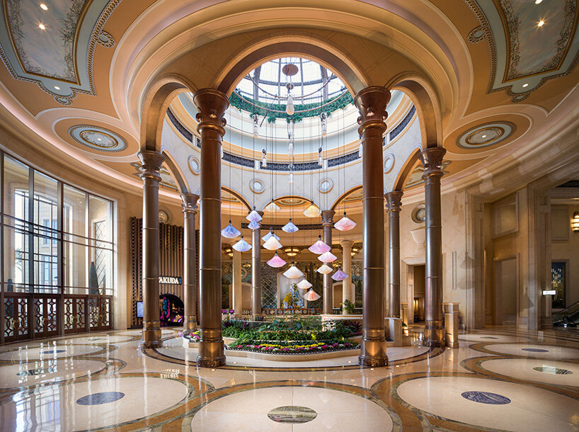 DRIFT kinetic flowers in the Palazzo lobby DRIFT kinetic flowers glowing pink blue and white above the Palazzo lobby | Sky Rye Design DRIFT kinetic flowers glowing pink blue and white above the Palazzo lobby