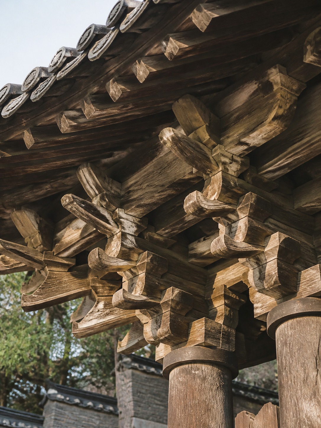 Interlocking gongpo wooden brackets supporting a palace roof without visible nails.