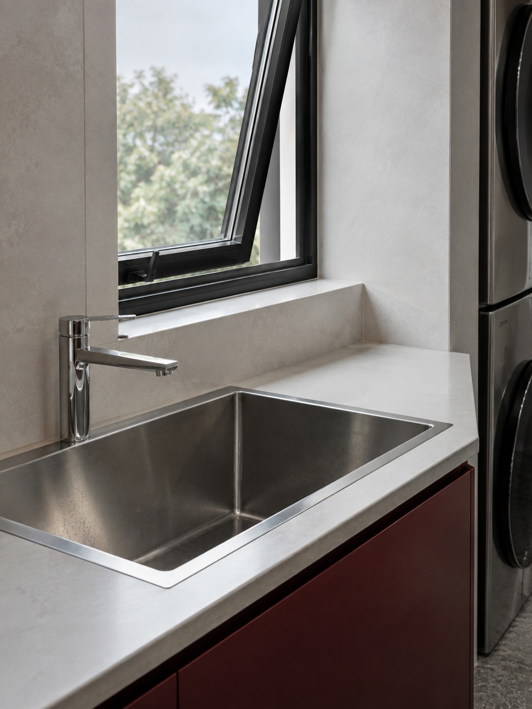 Operable window and laundry sink Tilt-open window above an inset stainless-steel laundry sink | Sky Rye Design Tilt-open window above an inset stainless-steel laundry sink