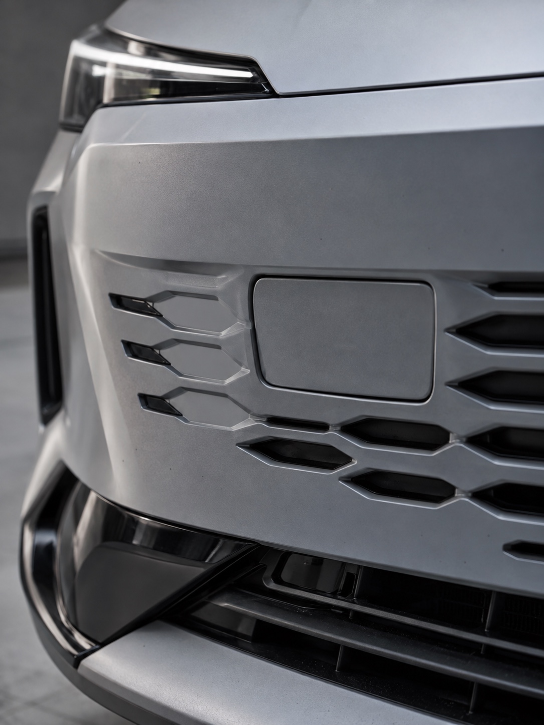 Radar Sensor Front Grille Detail Radar sensor concealed behind a body-color grille panel on a modern car | Sky Rye Design Radar sensor concealed behind a body-color grille panel on a modern car