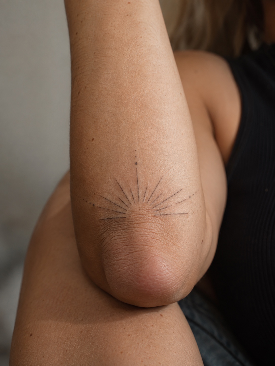 Radial fine line elbow tattoo A small radial tattoo sits over a bent elbow | Sky Rye Design A small radial tattoo sits over a bent elbow