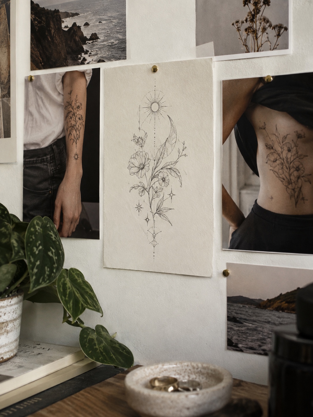 Tattoo design and placement references A botanical sketch and forearm and torso reference photographs pinned to a wall | Sky Rye Design A botanical sketch and forearm and torso reference photographs pinned to a wall