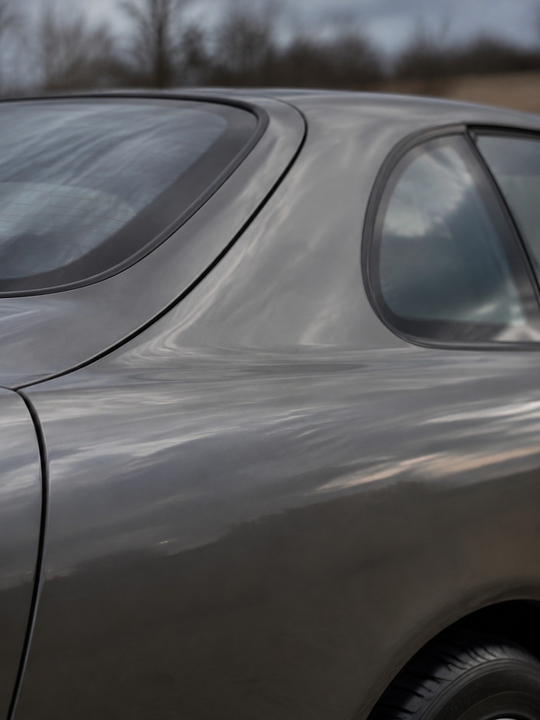 Toyota Celica rear quarter and roofline taper A close detail of a Toyota Celica rear quarter panel showing the tapering roofline and soft reflections. | Sky Rye Design A close detail of a Toyota Celica rear quarter panel showing the tapering roofline and soft reflections.