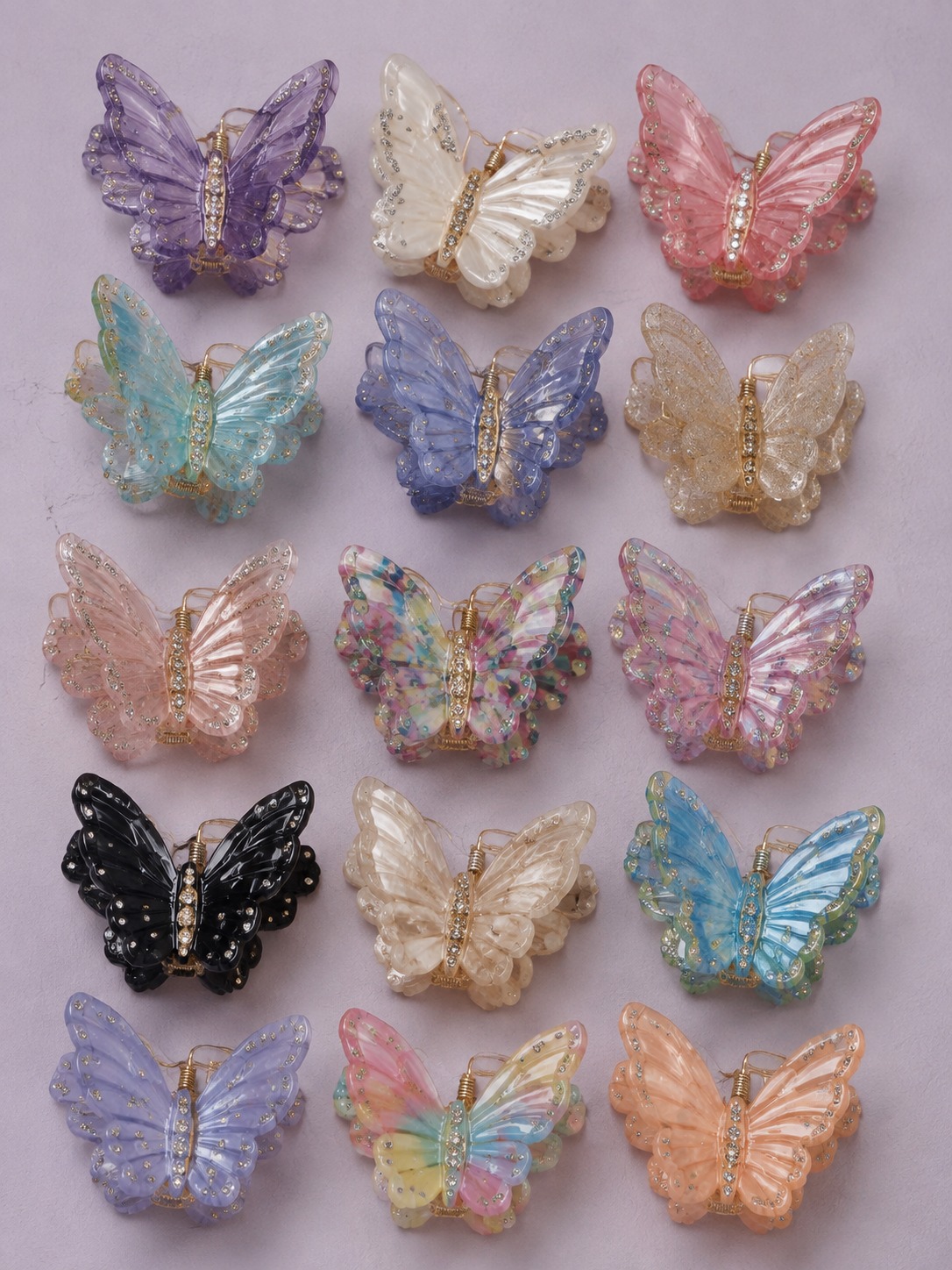 Butterfly hair clips Colorful butterfly hair clips arranged on a pastel surface | Sky Rye Design Colorful butterfly hair clips arranged on a pastel surface