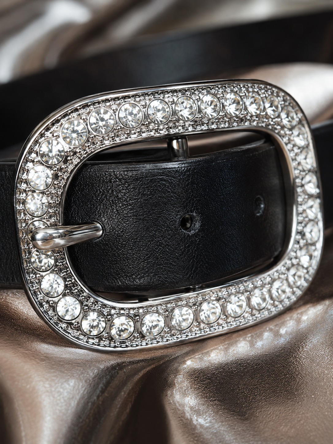 Rhinestone buckle close up Close-up of the faceted stones on a silver rhinestone belt buckle | Sky Rye Design Close-up of the faceted stones on a silver rhinestone belt buckle