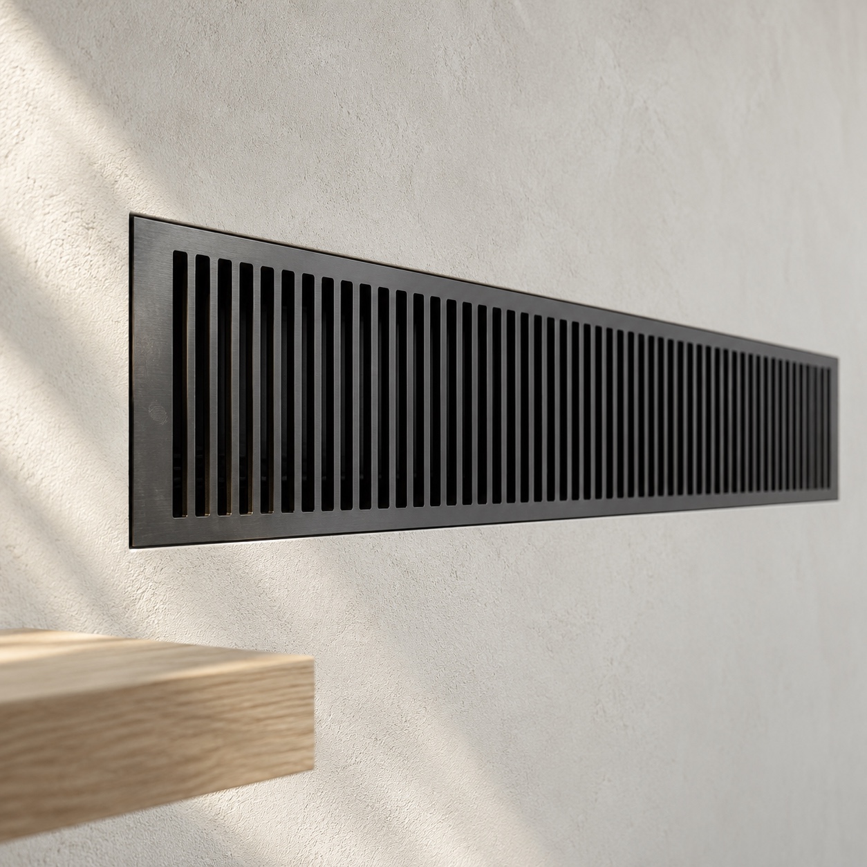 Custom Decorative HVAC Grille Thin black aluminum decorative HVAC grille set into pale plaster | Sky Rye Design Thin black aluminum decorative HVAC grille set into pale plaster