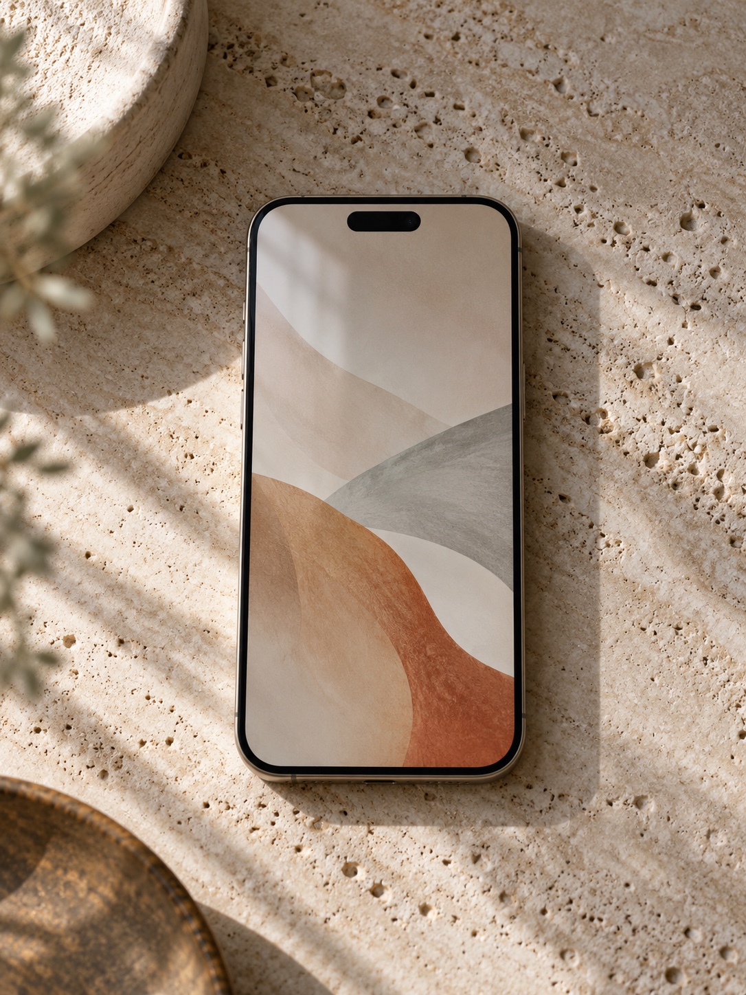 A phone lying on a travertine surface showing an abstract soft-toned wallpaper with open space at the top and bottom no legible text A phone lying on a travertine surface showing an abstract soft-toned wallpaper with open space at the top and bottom, no legible text | Sky Rye Design A phone lying on a travertine surface showing an abstract soft-toned wallpaper with open space at the top and bottom, no legible text