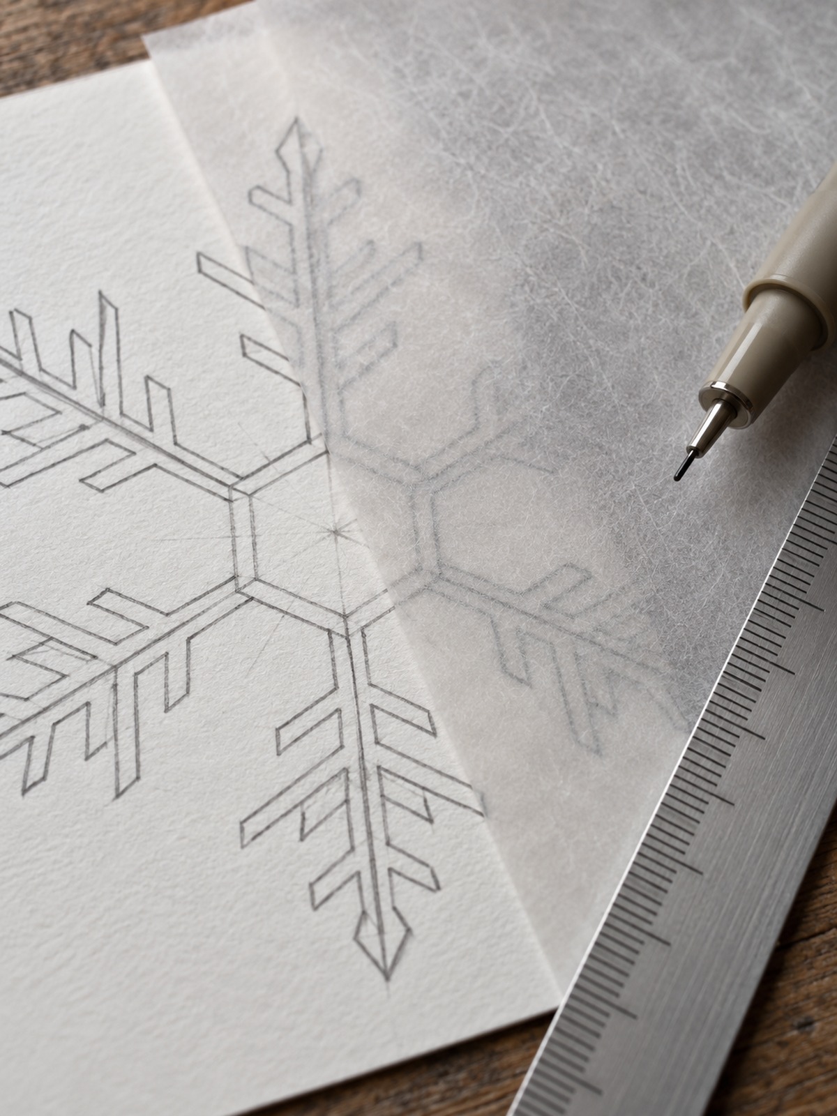 Tracing paper template placed over one snowflake arm Tracing paper template placed over one snowflake arm | Sky Rye Design Tracing paper template placed over one snowflake arm