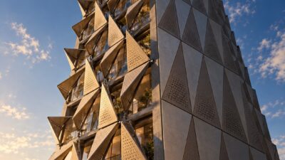 Triangular folding screens in open and closed positions on a glass tower