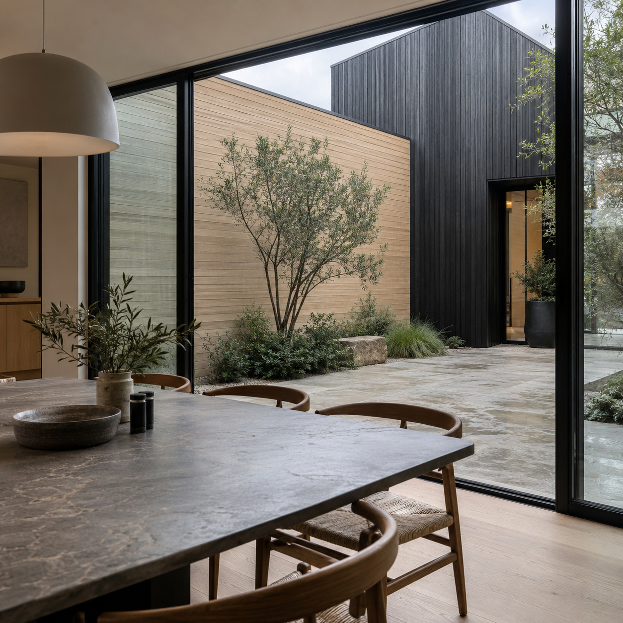 Dining room view of horizontal and vertical siding meeting at a corner