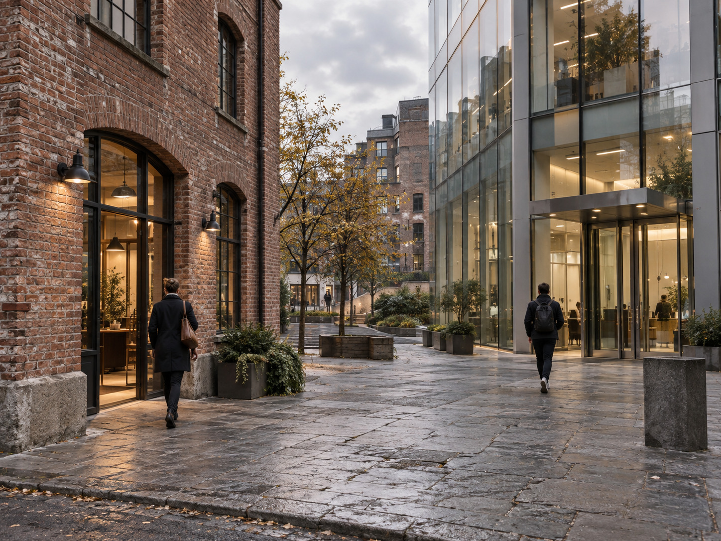 Brick warehouse and modern glass building facing the same public square